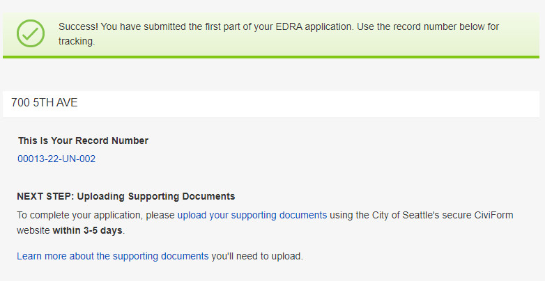 Success screen showing a valid submission, record number, address and next steps.